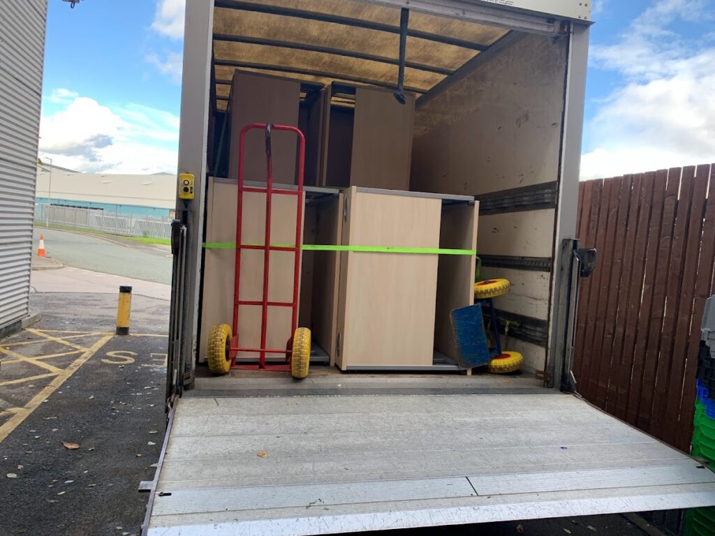 moving office equipment in van